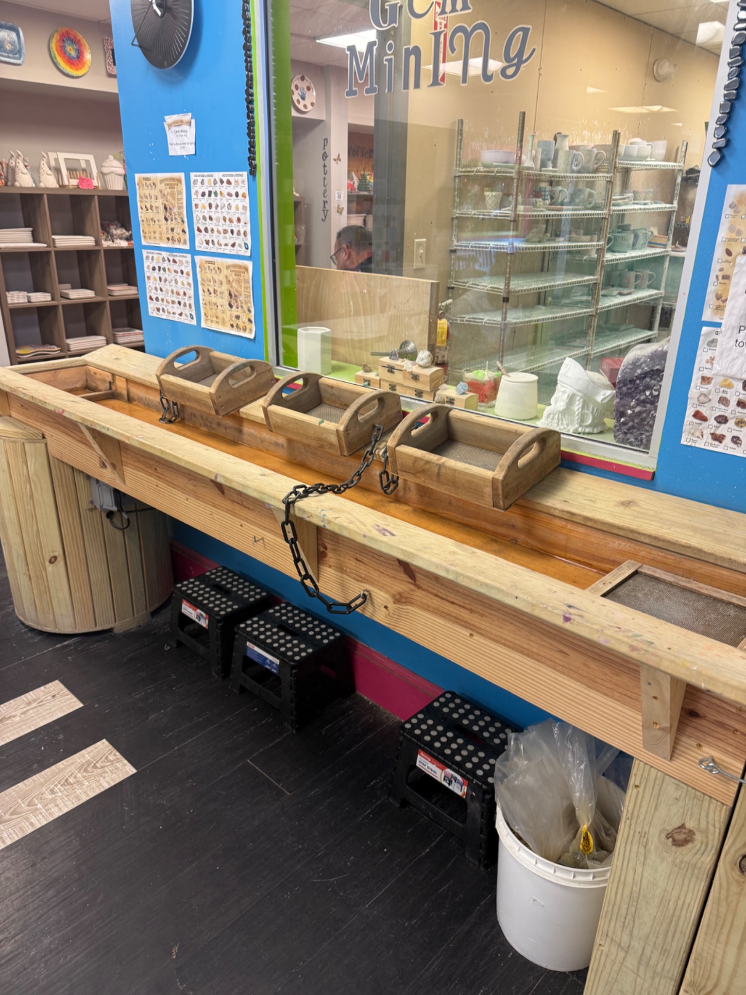 A closer view of the gem-mining sluice and wooden sifting trays