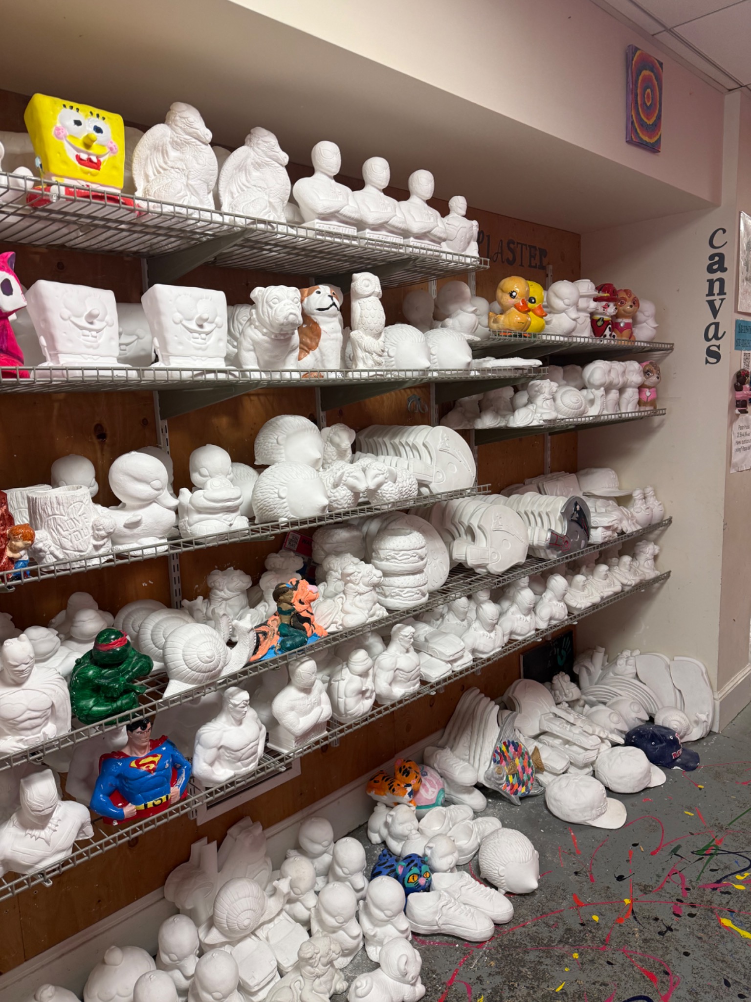 More plaster figures and shapes on the studio shelves