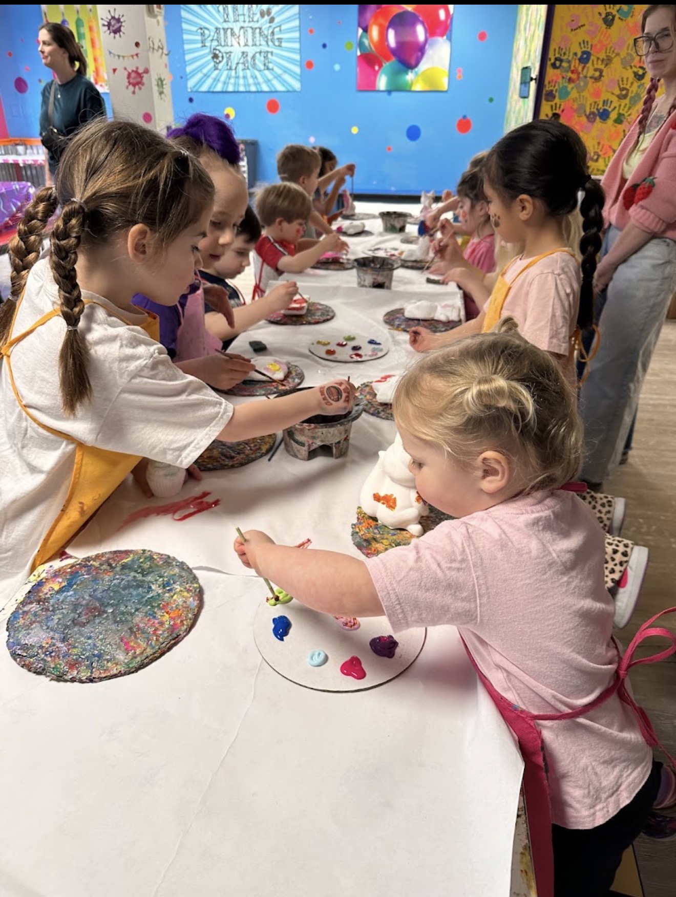 Children painting together at The Painting Place