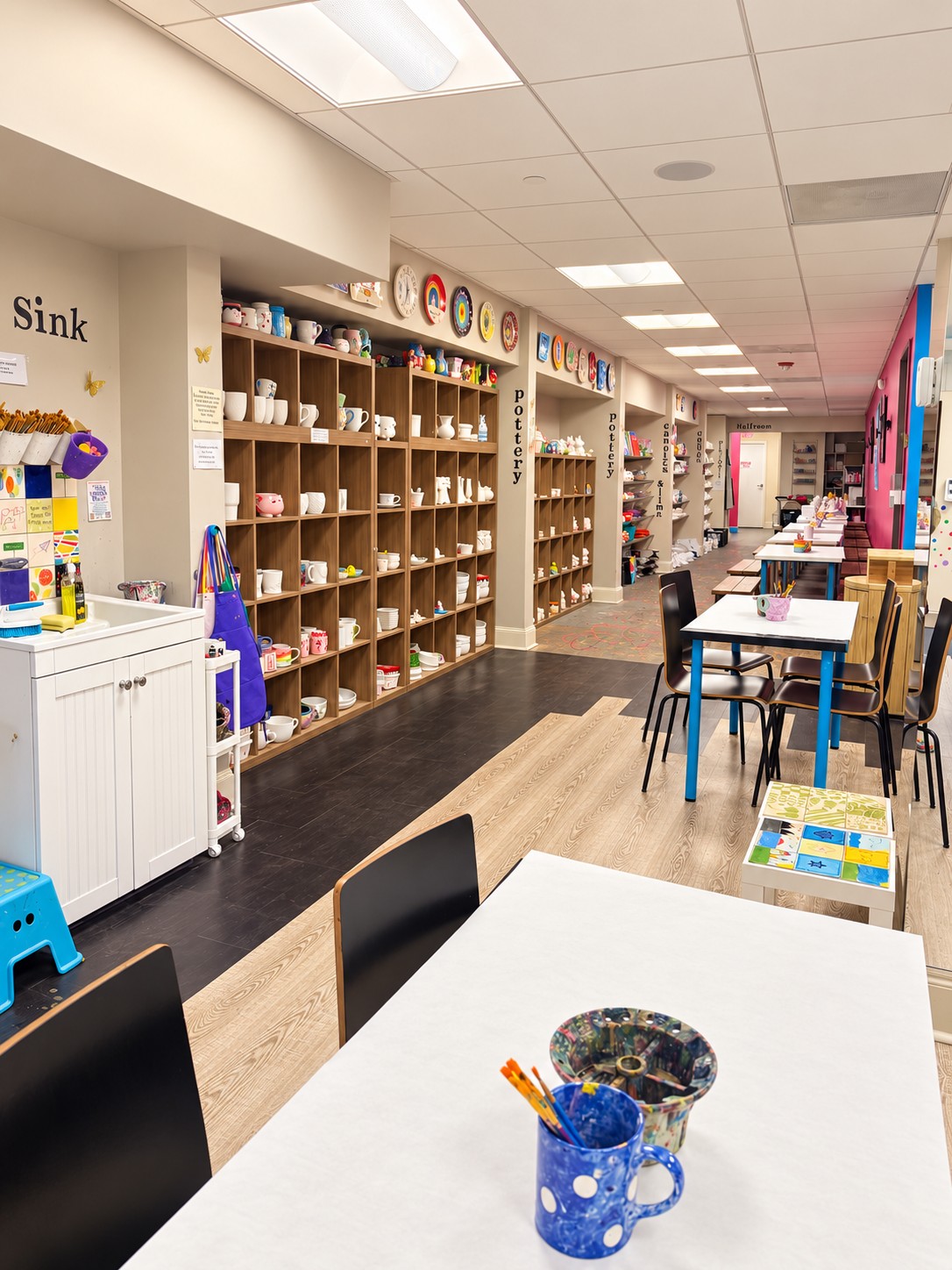 Inside The Painting Place: pottery shelves, colorful projects and tables ready for you to create