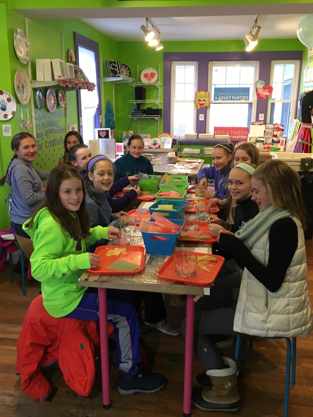 Children making colorful projects together at The Painting Place